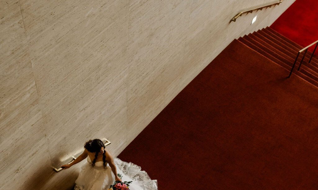 Michelle’s elegant bridal session at Jones Hall in Downtown Houston featured a stunning Fiancee Bridal Spring gown and bouquet by Urban Rubbish.