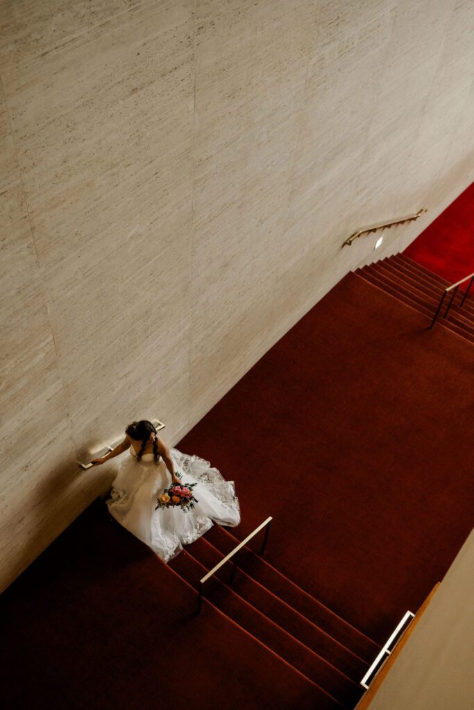 Michelle’s elegant bridal session at Jones Hall in Downtown Houston featured a stunning Fiancee Bridal Spring gown and bouquet by Urban Rubbish.